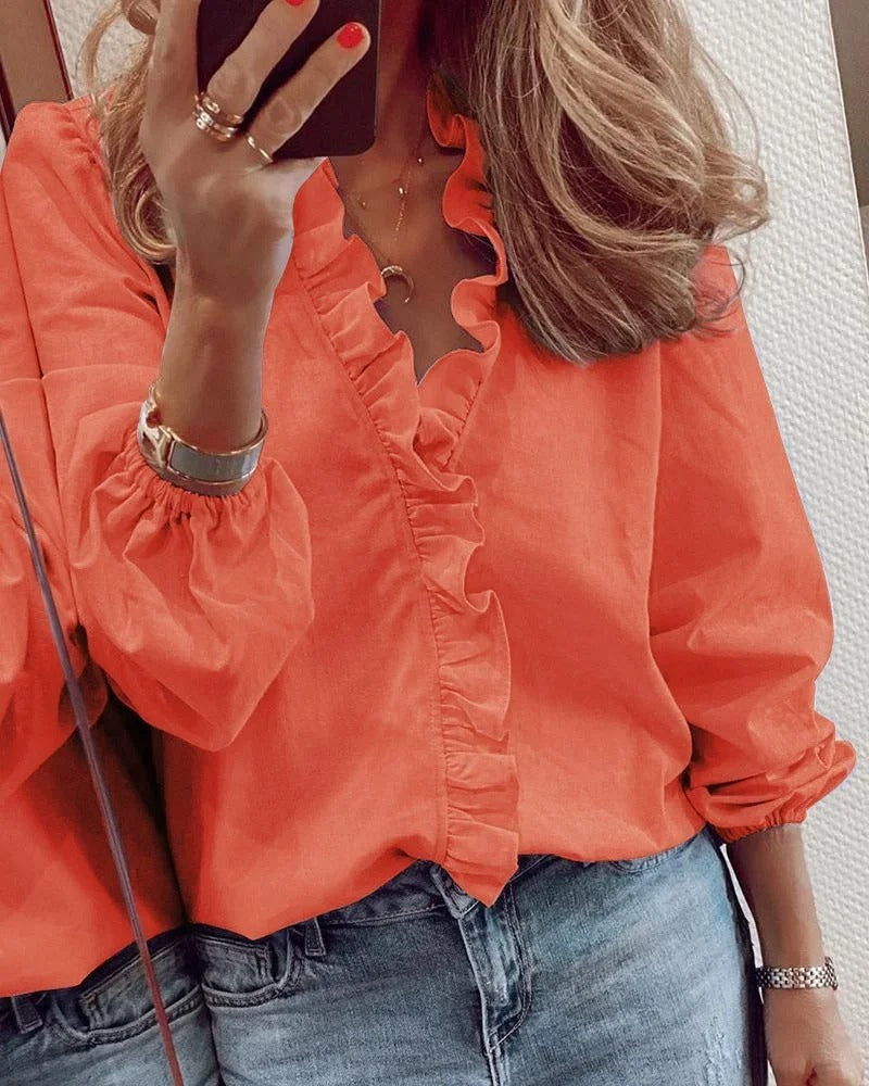 Delphine™ - Long-sleeved blouse with a V-neck and ruffles